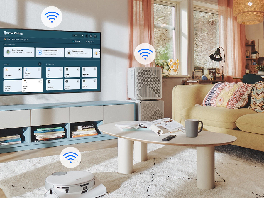 Na ekranie telewizora widać menu SmartThings. Ikonki WiFi pokazane nad telewizorem, odkurzaczem samojezdnym i oczyszczaczem powietrza. BU8002KXXH