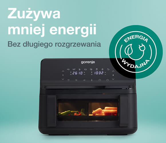 Czarna frytkownica beztłuszczowa marki Gorenje z cyfrowym panelem sterowania i dwoma komorami, w których widać podświetlone jedzenie, na tle turkusowej ściany z napisem Zużywa mniej energii. Bez długiego rozgrzewania oraz zieloną ikoną Energia wydajna z symbolem wtyczki.