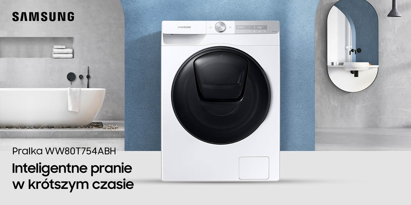 Pralka samsung znajduje się w łazience w tyłu w tle jest lustro i wanna 